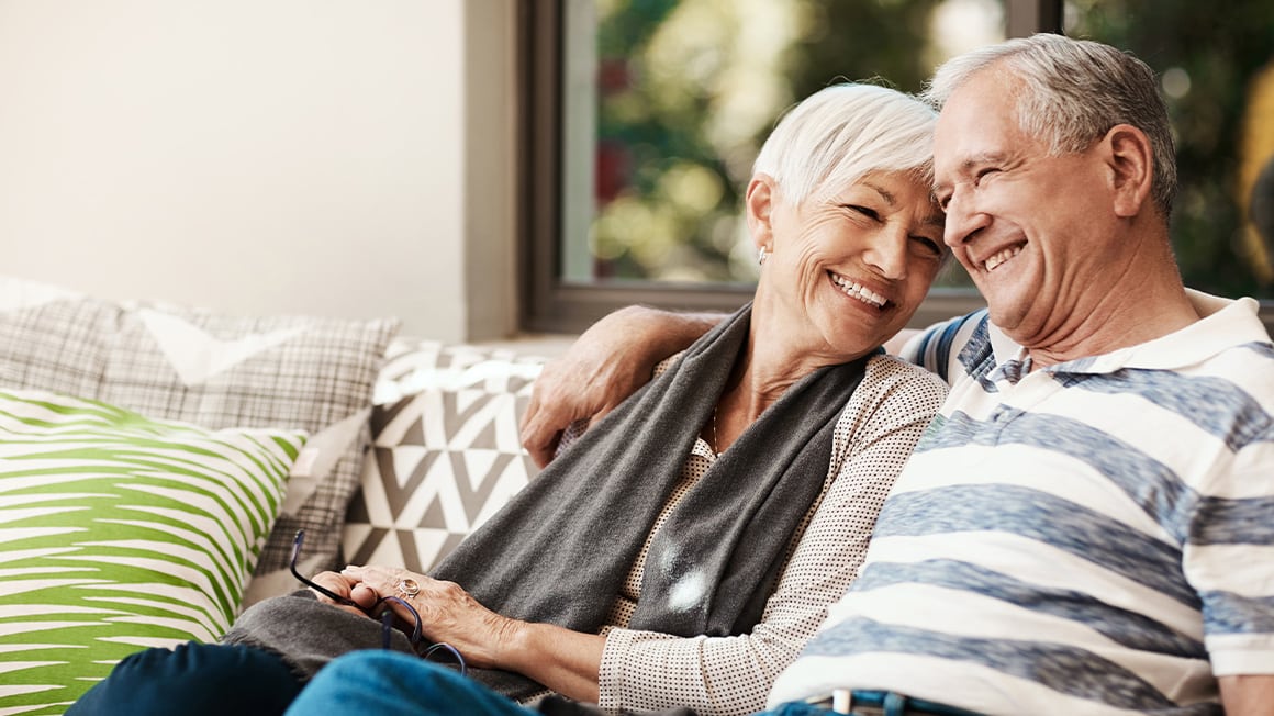 Happy older couple on the couch