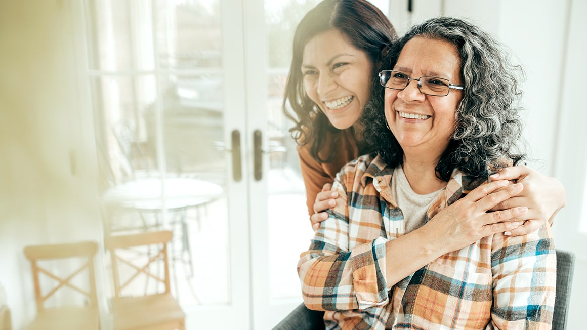 Daughter hugging mother