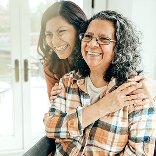 Daughter hugging mother